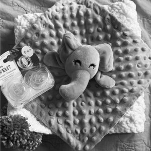 White handmade crochet baby blanket with elephant lovey and pacifiers gift set